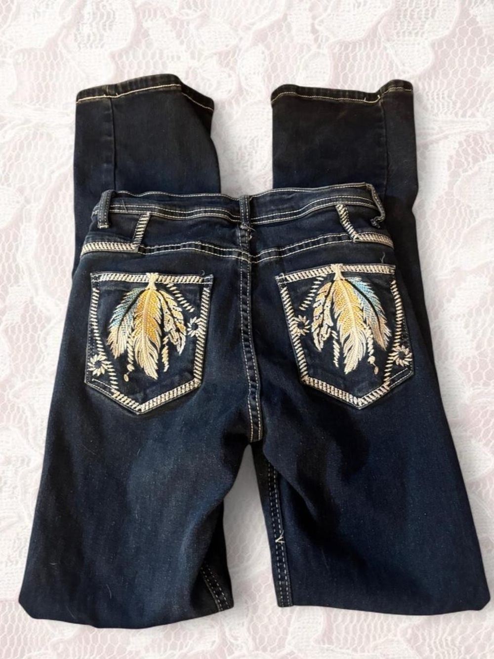 Dark wash feather embroidered boot cut jeans